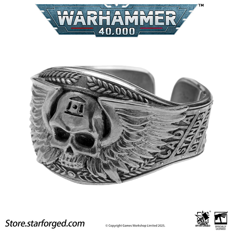 Astra Militarum De Gloria Cadia Ring Cadian Shock Troopers Warhammer Memorial Ring Gold & Silver A ring depicting the winged skull emblem of the Astra Militarum. With the Cadian Gate’s logo etched on its forehead, representing the heroic Cadian Shock Troopers. Their famous warcry, ‘Cadia stands!’ echoes with it.