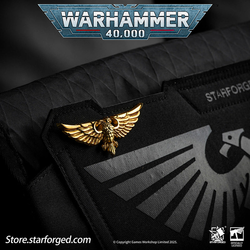 In the war-torn galaxy, the Aquila and the Imperial Skull are symbols every citizen of the Imperium knows well.

It is said that the twin heads of the Aquila represent Terra and Mars, while one eye gazes into the future and the other looks upon the past. The Imperium wages an eternal war for survival across the stars, and for humanity, the Aquila stands as the last beacon of hope in the darkness. The rule of Terra is not kind, and the Imperial regime is far from benevolent—yet only beneath the golden wings 